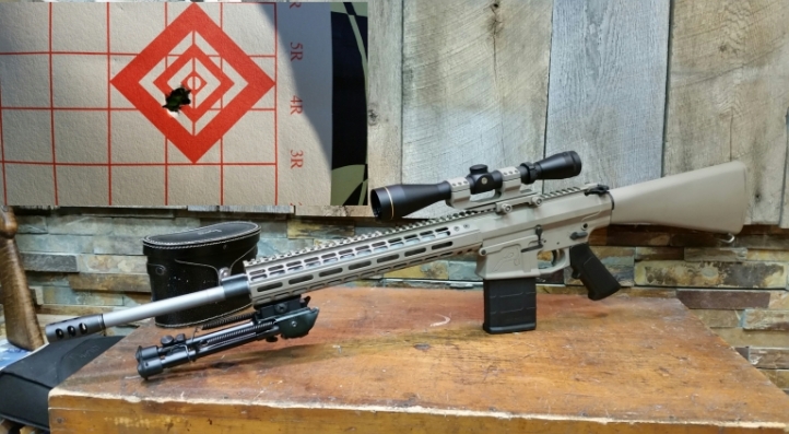 Custom AR308 Built with Aero Precision M5E1 components.  Cerakote is Magpul FDE.  Scope is a Leupold VX-2 4-12 X 40.  Target is a 3 round group fired at 200 yds.